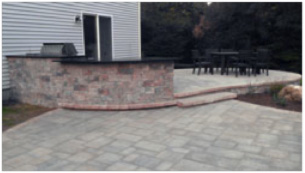 Outdoor kitchen with retaining wall in Rocky Hill CT