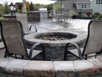 The fire pit has a seating wall, yet also has a large enough area for seating on chairs