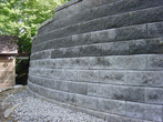 Engineered wall stops erosion and protects building.