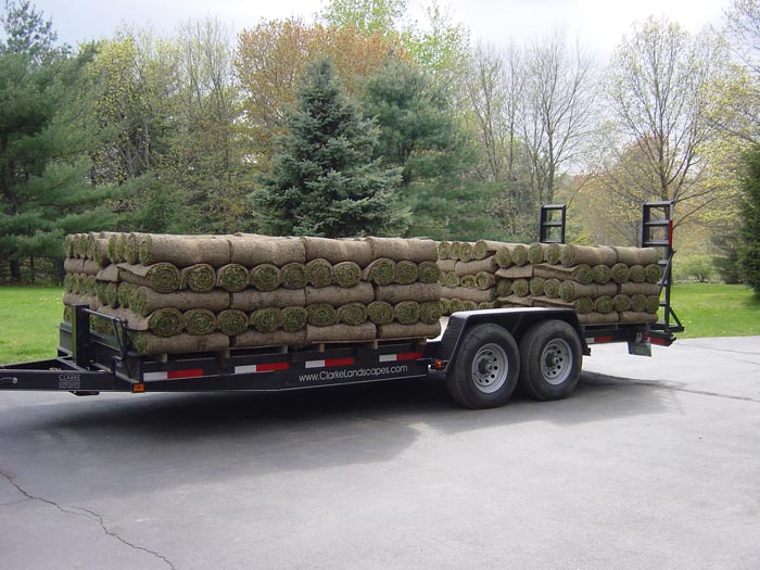 Truck pulling up with sod on trailer